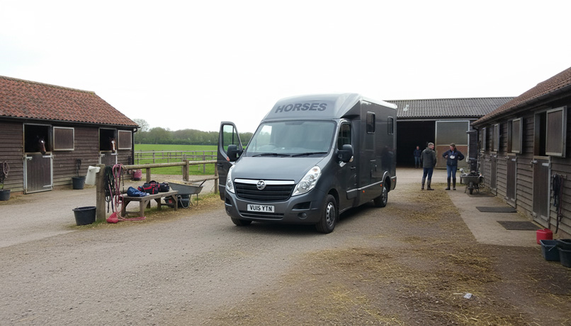 Silver horsebox delivery at a yard